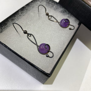 Off stone purple earrings